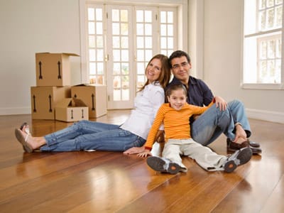 family sitting, with packing boxes